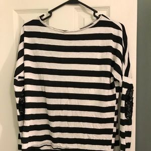 Black striped high, low shirt.
